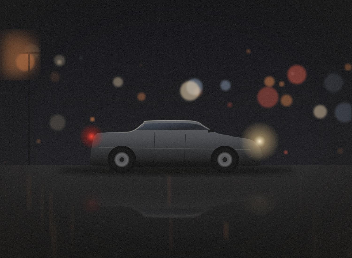 A grey Skyline GT-R parked under street lights at night